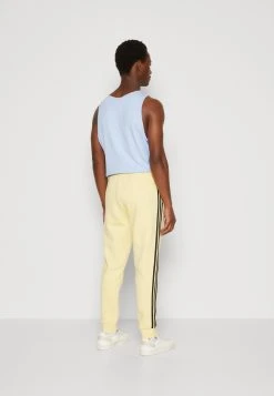 Adidas Originals Stripes Pant Unisex - Tracksuit Bottoms - Almost Yellow -Adidas Shop 9bc3ff8dd177432e81cd85e8cc5c0756
